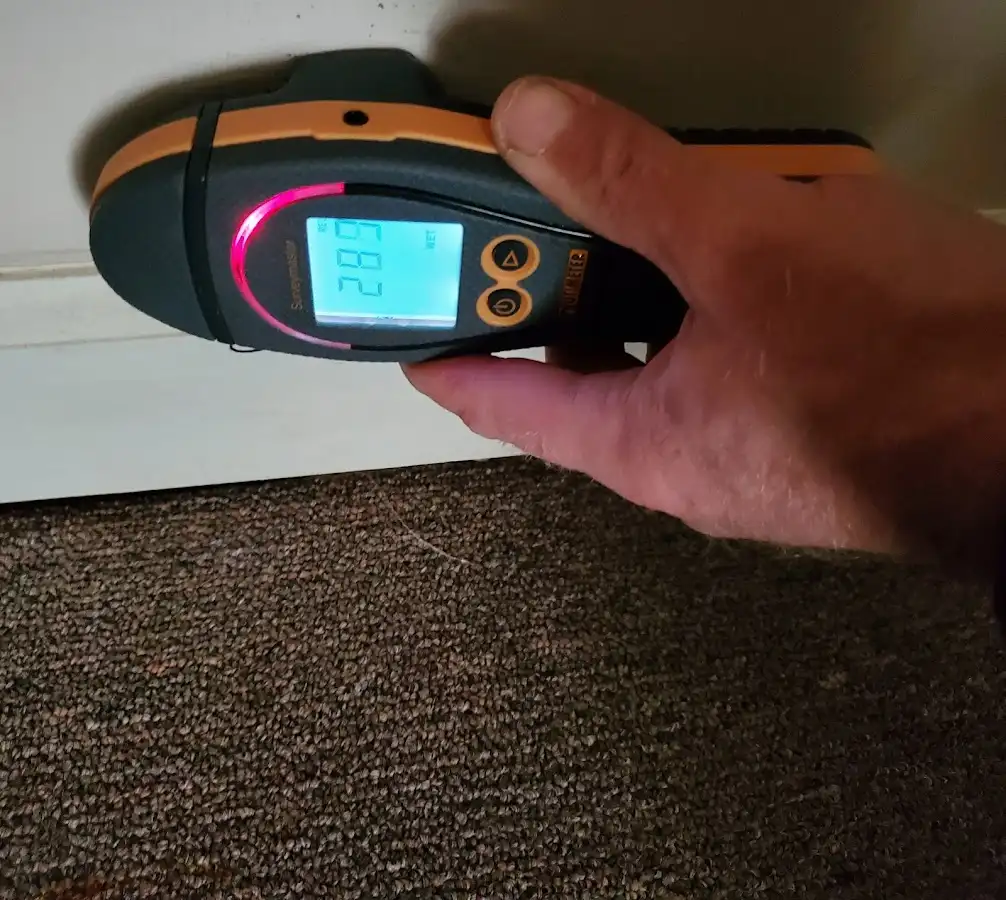 Moisture detection at baseboard during Storm Damage Restoration in Wilmette